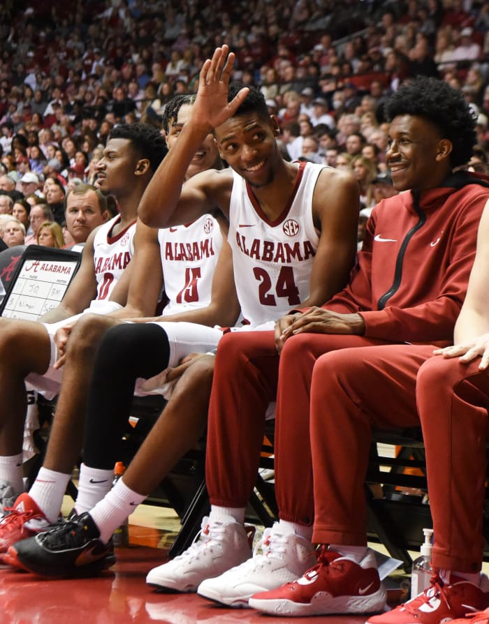 Alabama Crimson Tide forward Brandon Miller (24) waves at Alabama Crimson Tide football coach Nick Saban (not pictured) after coming out of the game against the Georgia Bulldogs at Coleman Coliseum.